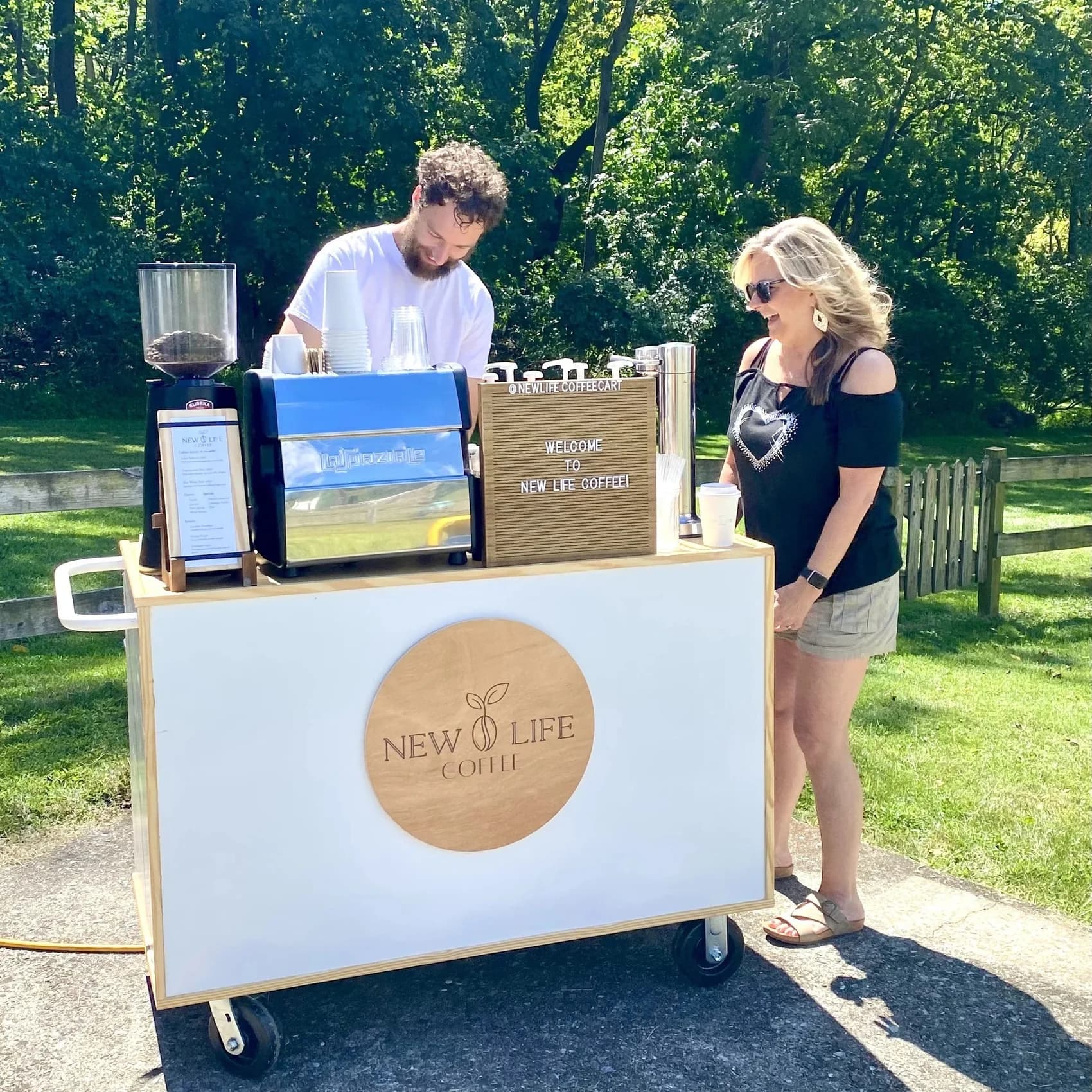 Mobile coffee cart set up outdoors at a campus event