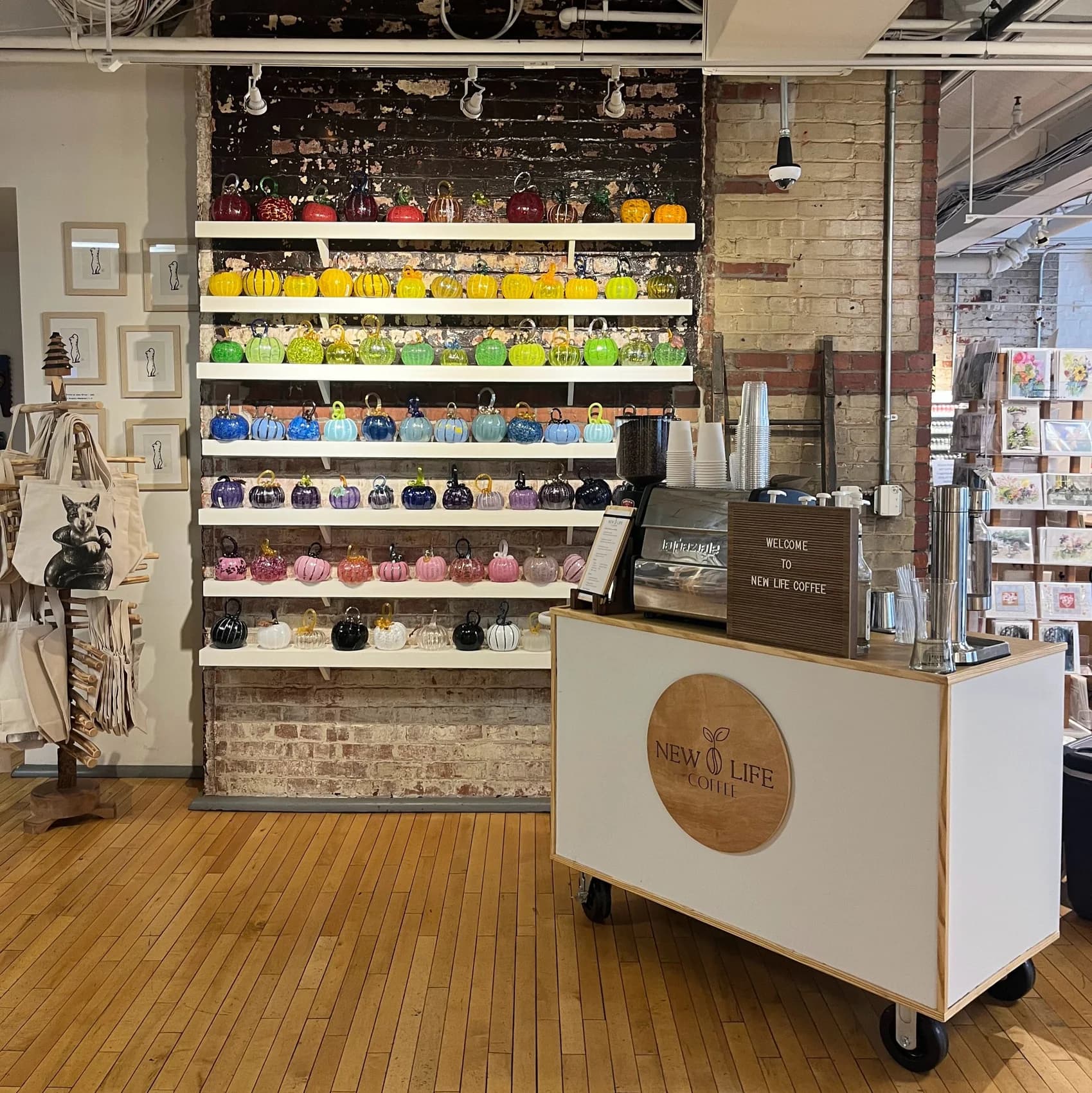 Mobile coffee cart set up inside a colorful retail store for a brand activation