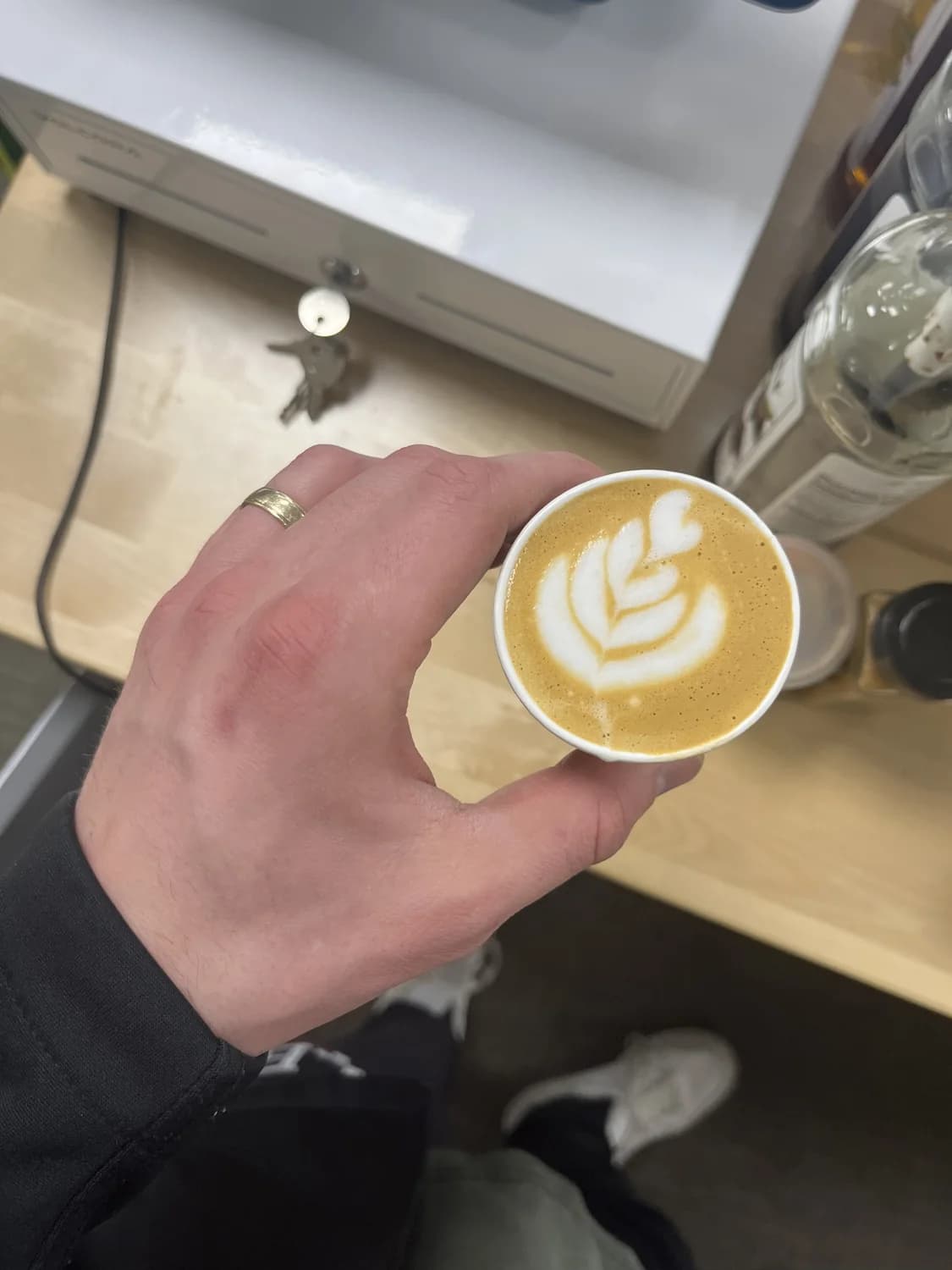 Close-up of latte art in a cup at a catered coffee event