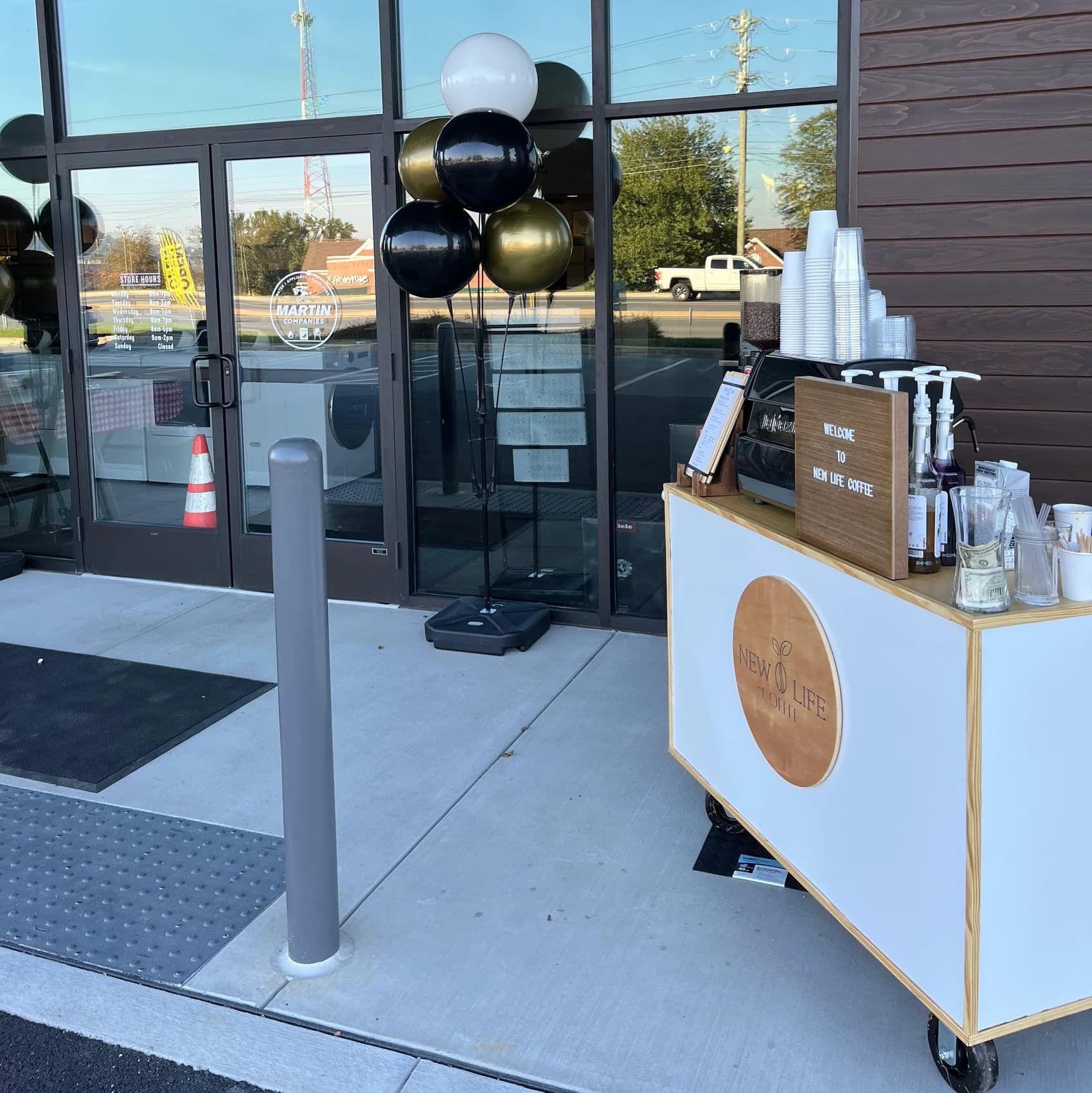 New Life Coffee Company mobile coffee cart set up outdoors at an event entrance